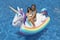 Swim Central 86" Inflatable Rainbow Unicorn Rocker Swimming Pool Float